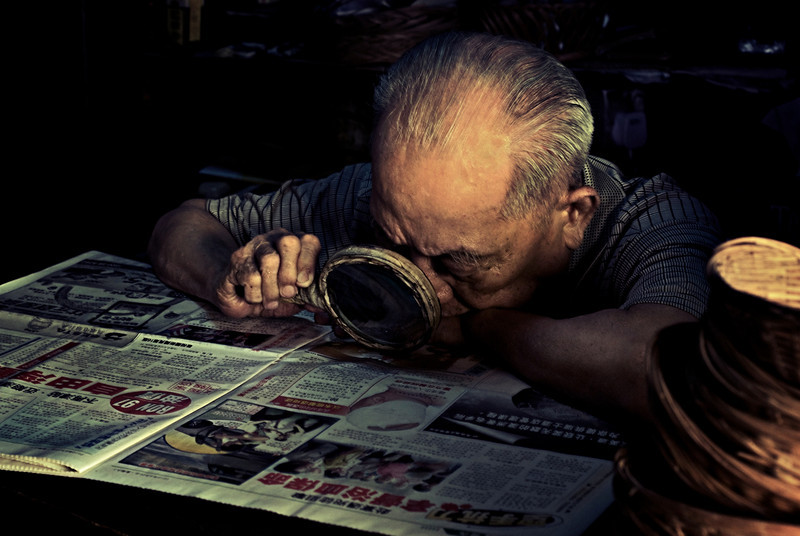 Old read. Old man read. Old man reading book. Old men reading. Elderly people reading a book on the desktop at Night.